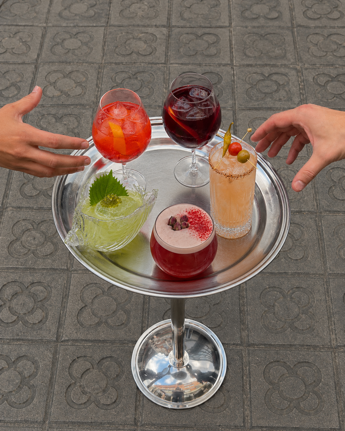 Selection of signature cocktails served on a silver tray at Tzura