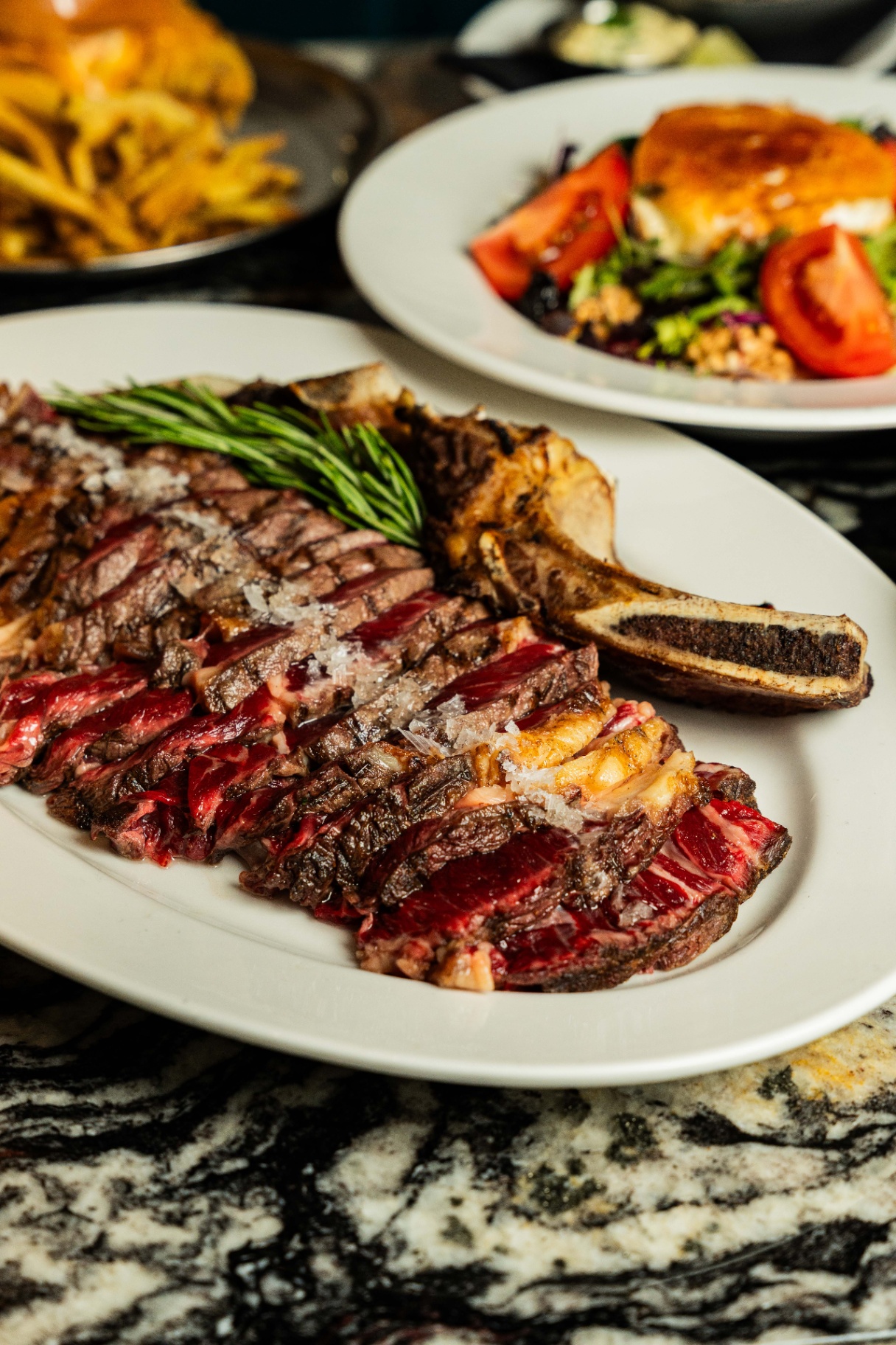 Ribeye with sides and salad